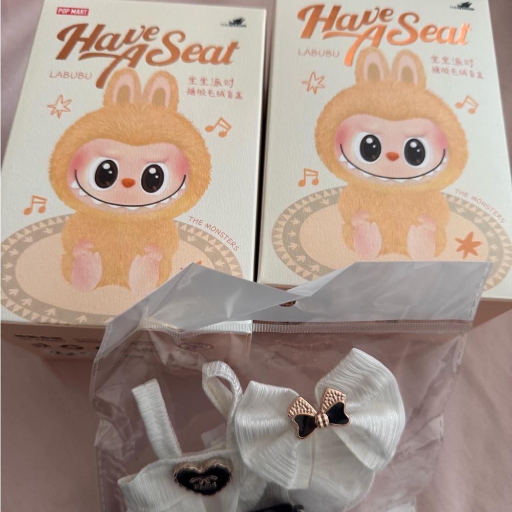 2 Have a seat Labubus with cute Chanel outfit